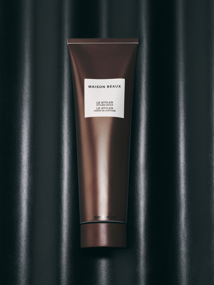 Le Styler 150 ML squeeze tube on a dark background.