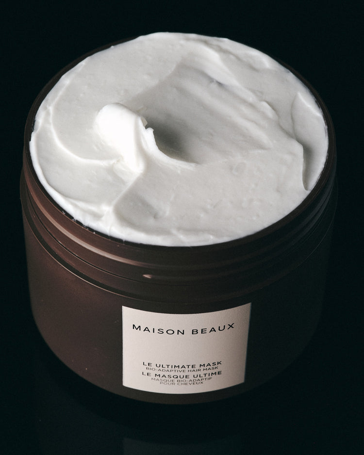 Open jar of Le Ultimate Mask showing white repairing cream.