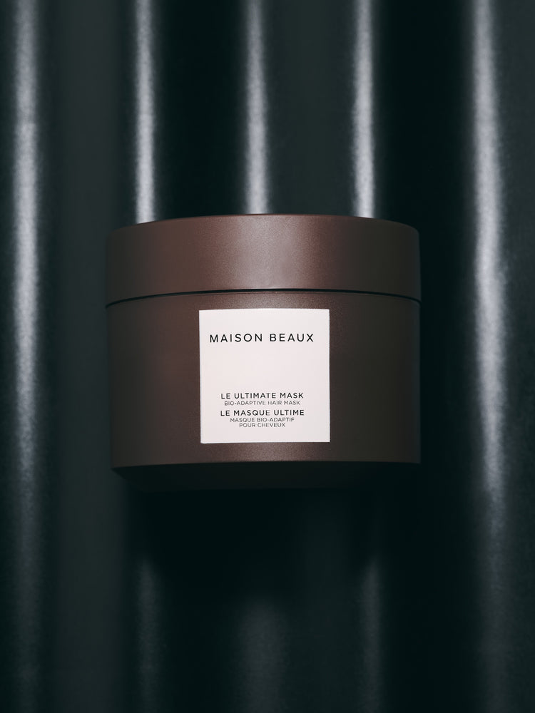 Le Ultimate Mask 240 ML jar on a dark background.